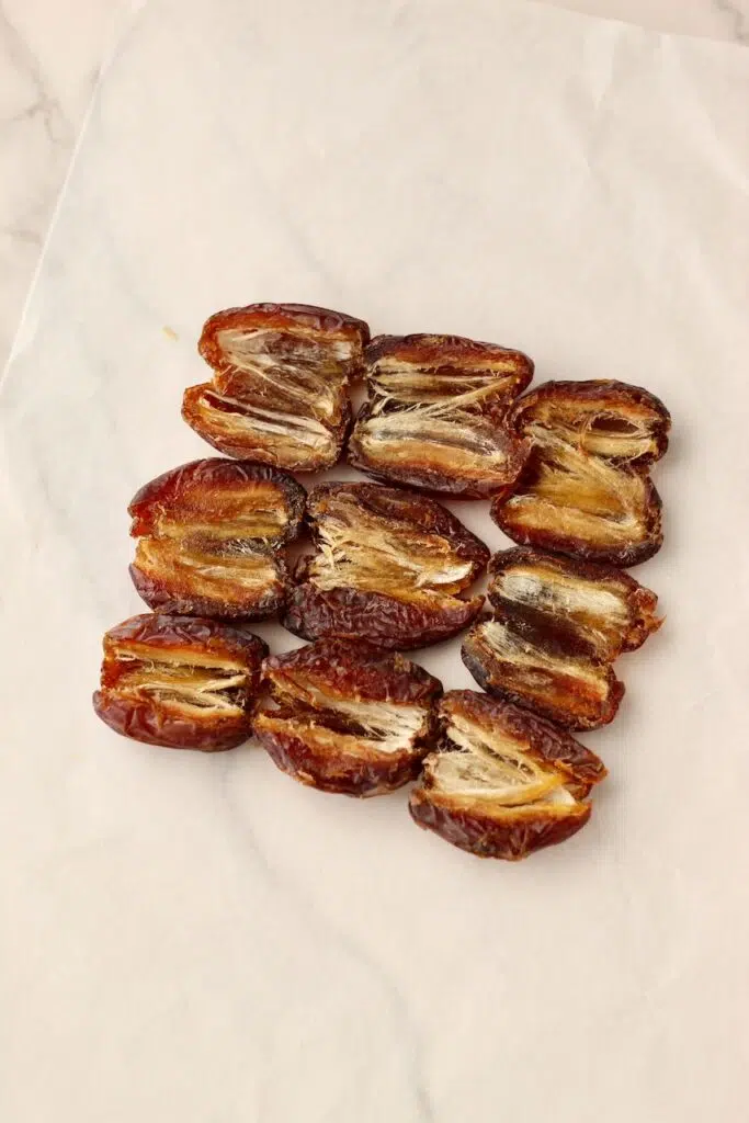 Medjool dates pitted and in 3x3 grid on wax paper