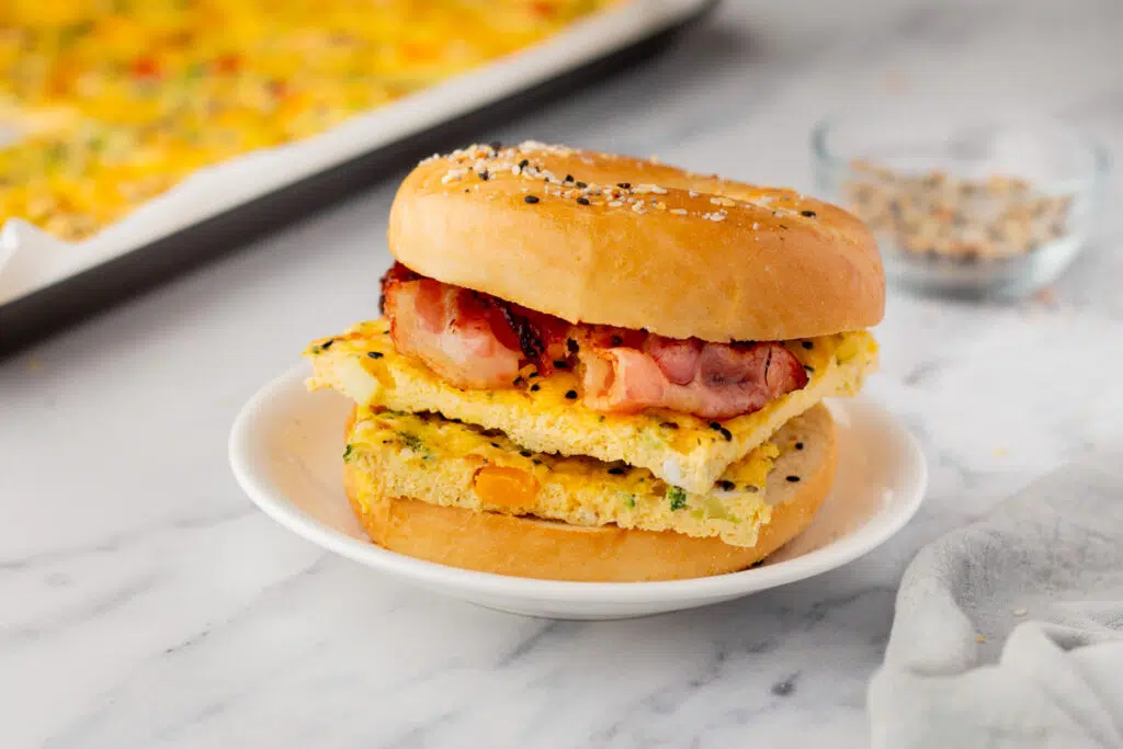 Bagel breakfast sandwich with sheet pan eggs squares 