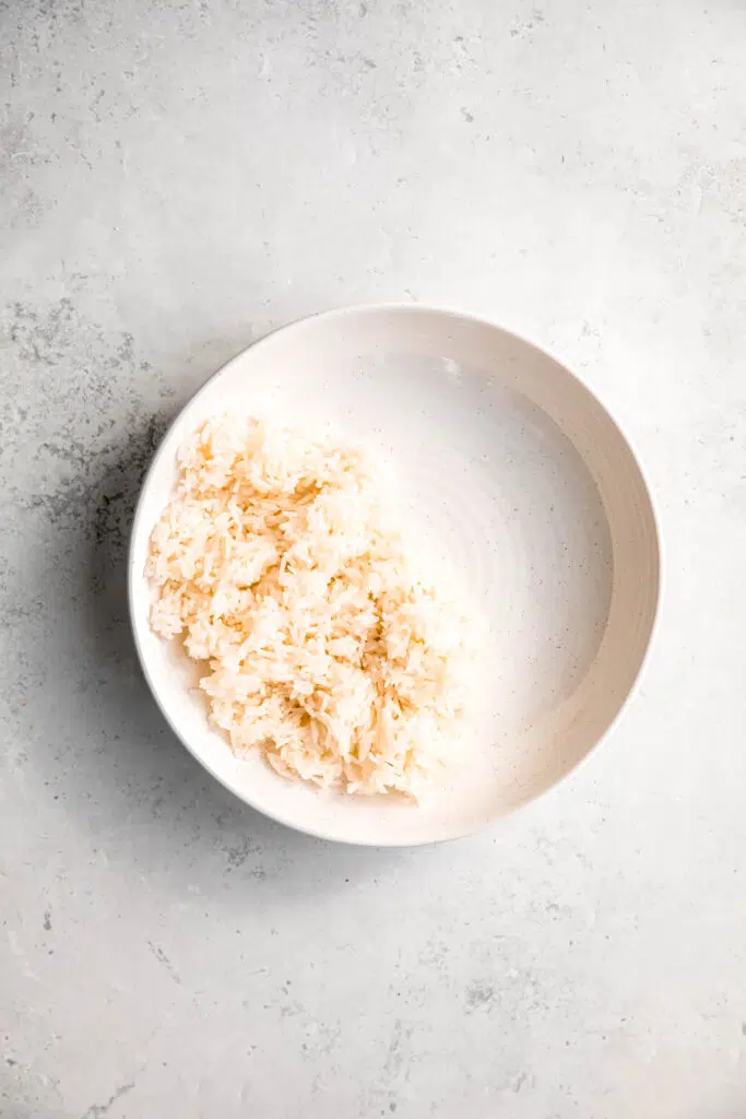 White rice portioned in white bowl