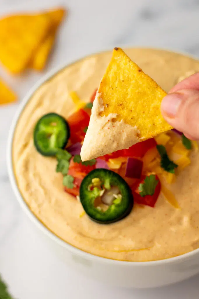 Chip dipped in Cottage Cheese Queso Dip 