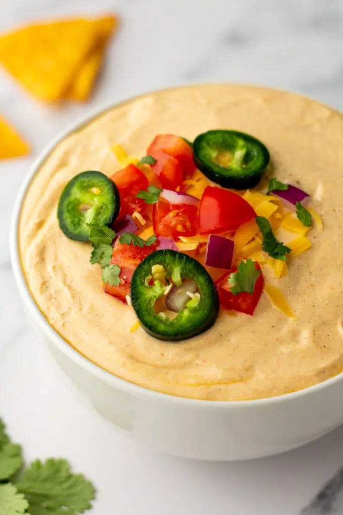 Close up of cottage cheese queso dip with garnish