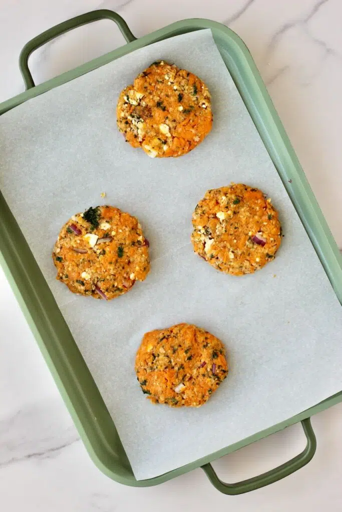 4, 4 inch sweet potato patties on baking sheet