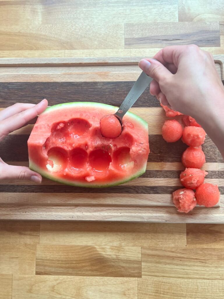 Scooping watermelon balls with 1/2 tablespoon