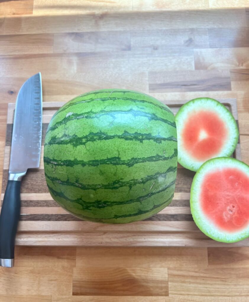 Watermelon on cutting board with ends cut off