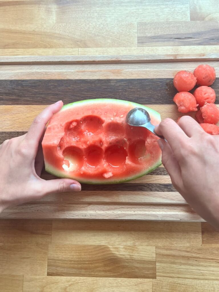 Scooping watermelon balls with 1/2 tablespoon