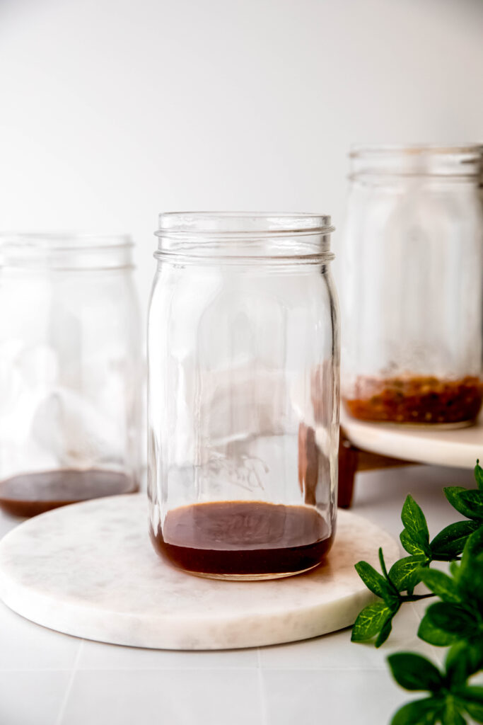 Mason jar with dressing in bottom