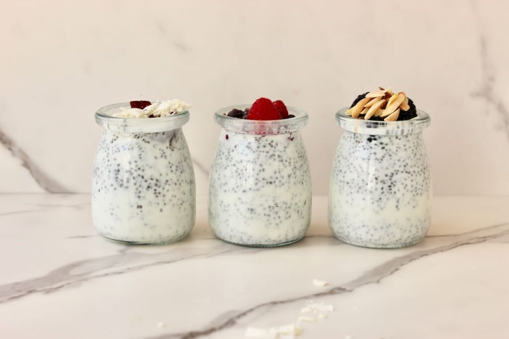 3 types of chia pudding in jars with different toppings