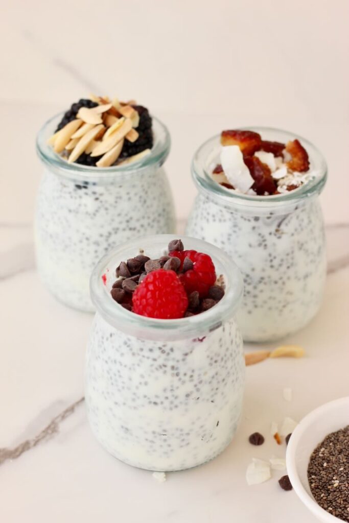 3 types of chia pudding in jars with different toppings