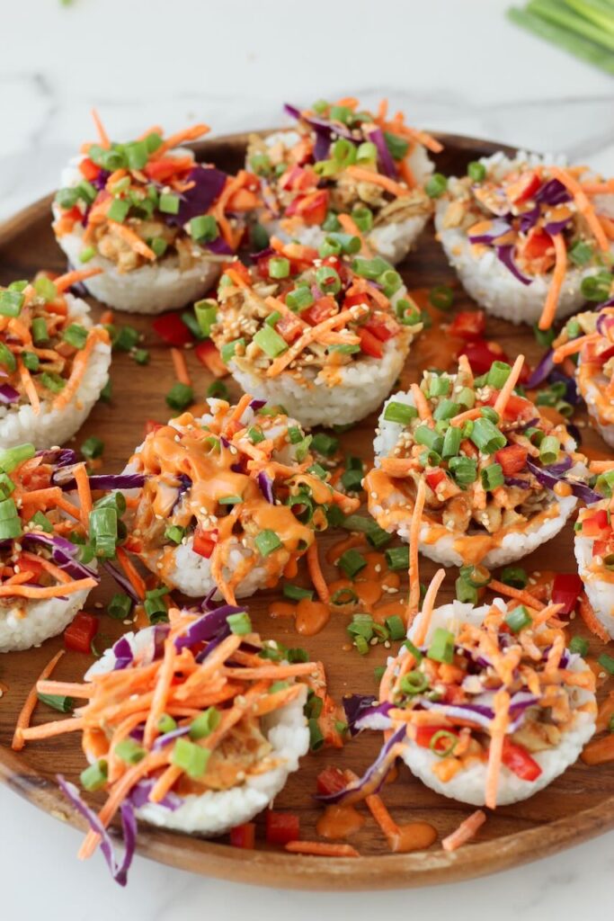 Korean BBQ Chicken Rice Cups on wood serving plate