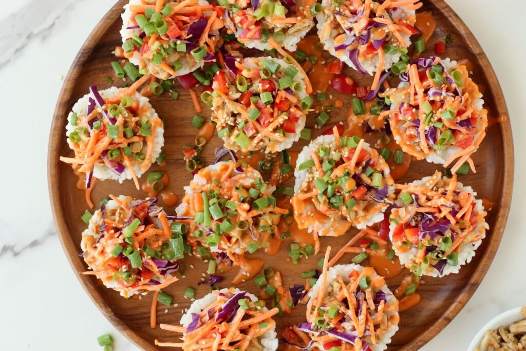 Korean BBQ Chicken Rice Cups on wood serving plate