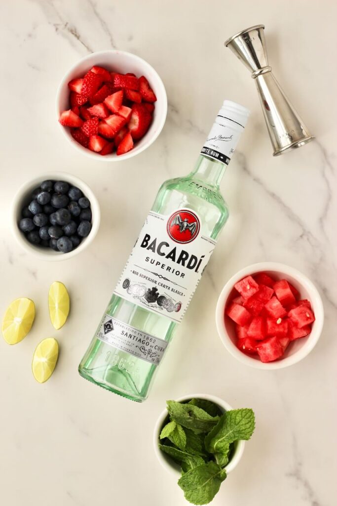 Customizable fruit mojito fruit options and bottle of Bacardi