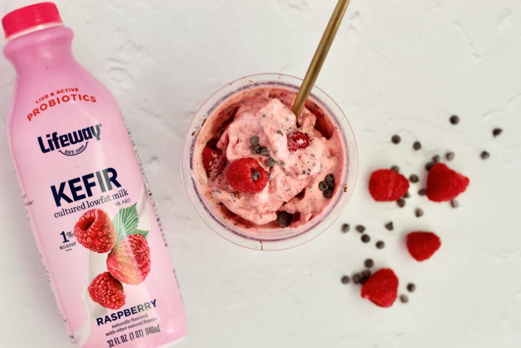 Raspberry Dark Chocolate Lifeway Kefir Protein Ice Cream in pint and Lifeway Kefir bottle