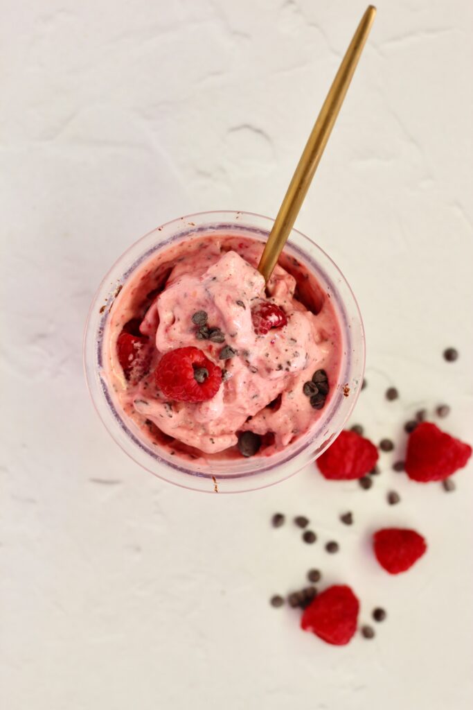 Final Raspberry Dark Chocolate Lifeway Kefir Protein Ice Cream in pint with gold spoon