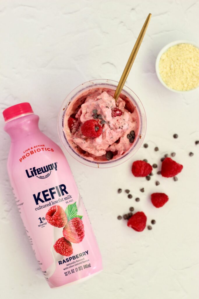 Raspberry Dark Chocolate Lifeway Kefir Protein Ice Cream in pint and Lifeway Kefir bottle