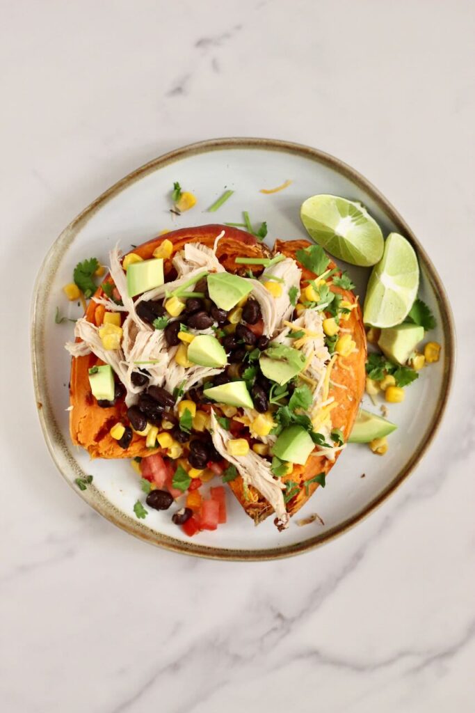 Stuffed Sweet Potato with toppings of choice on plate