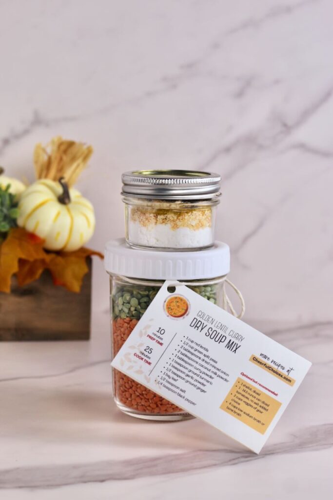 Golden Curry Lentil Dry Soup Mix in jar with recipe card attached and pumpkin decor in background