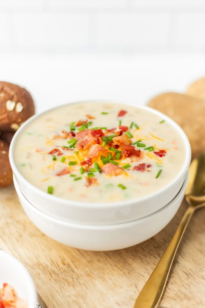 Creamy soup topped with bacon and chives.