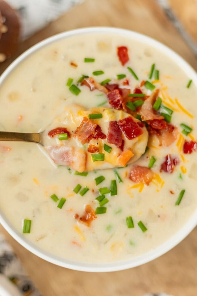 Mashed potato soup topped with bacon and cheese