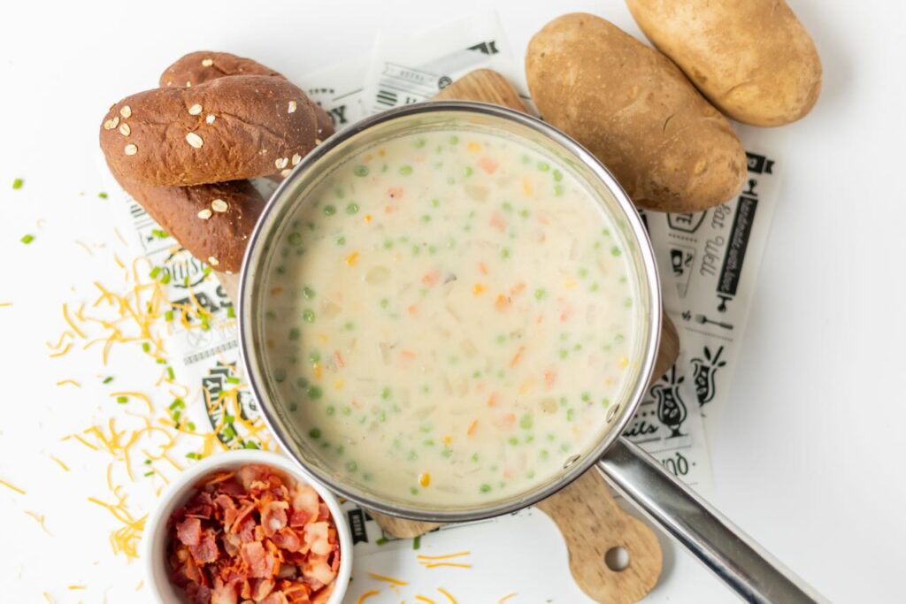 Creamy soup with bacon and vegetables