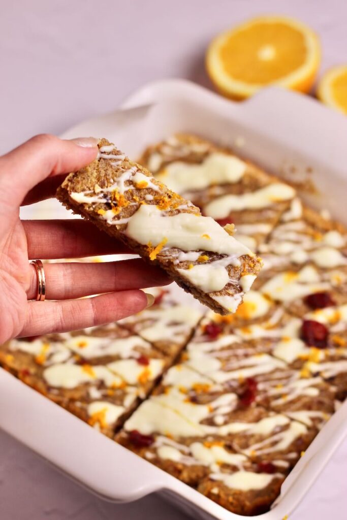 Hand holding Cranberry Orange Energy Bar