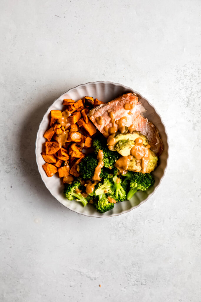 Power bowl with sauce on it