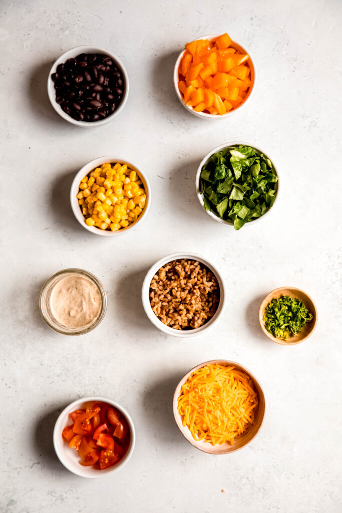 ingredients for power bowl in separate white bowls