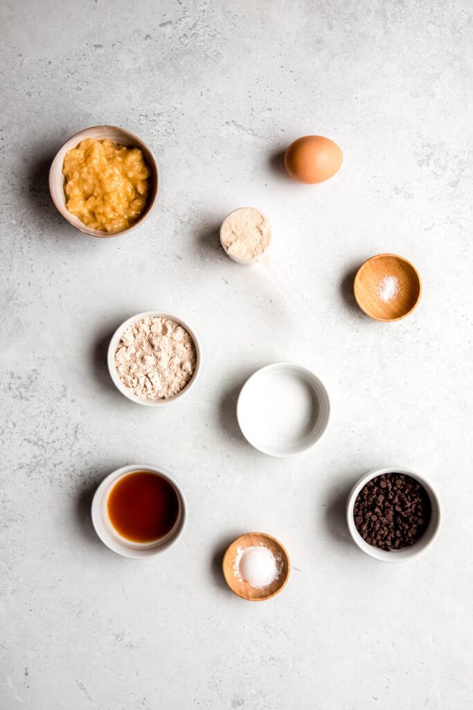 Ingredients for protein pancakes in separate white bowls