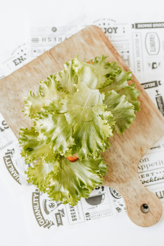 Lettuce on top of melted cheese