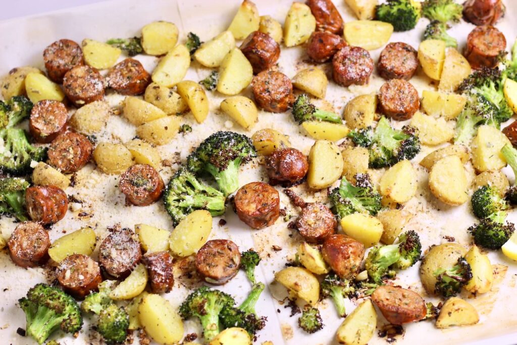 Sheet pan sausage and veggies golden brown after cooking