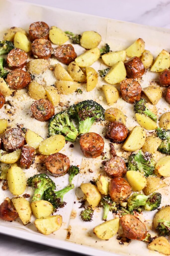 Sheet pan sausage and veggies golden brown after cooking