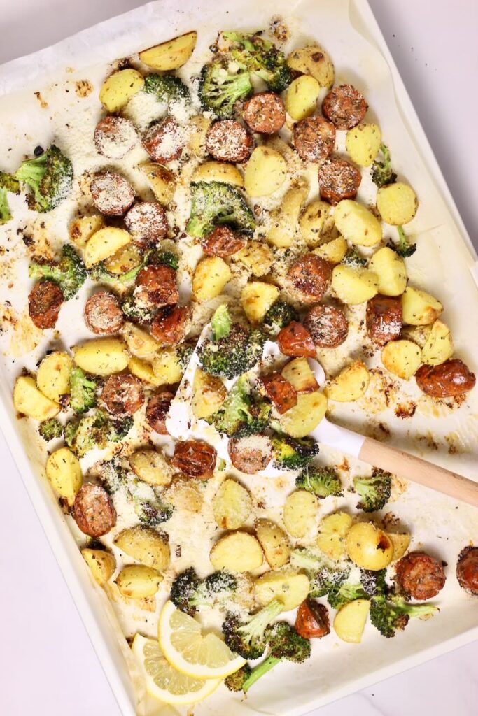 Sheet pan sausage and veggies with spatula