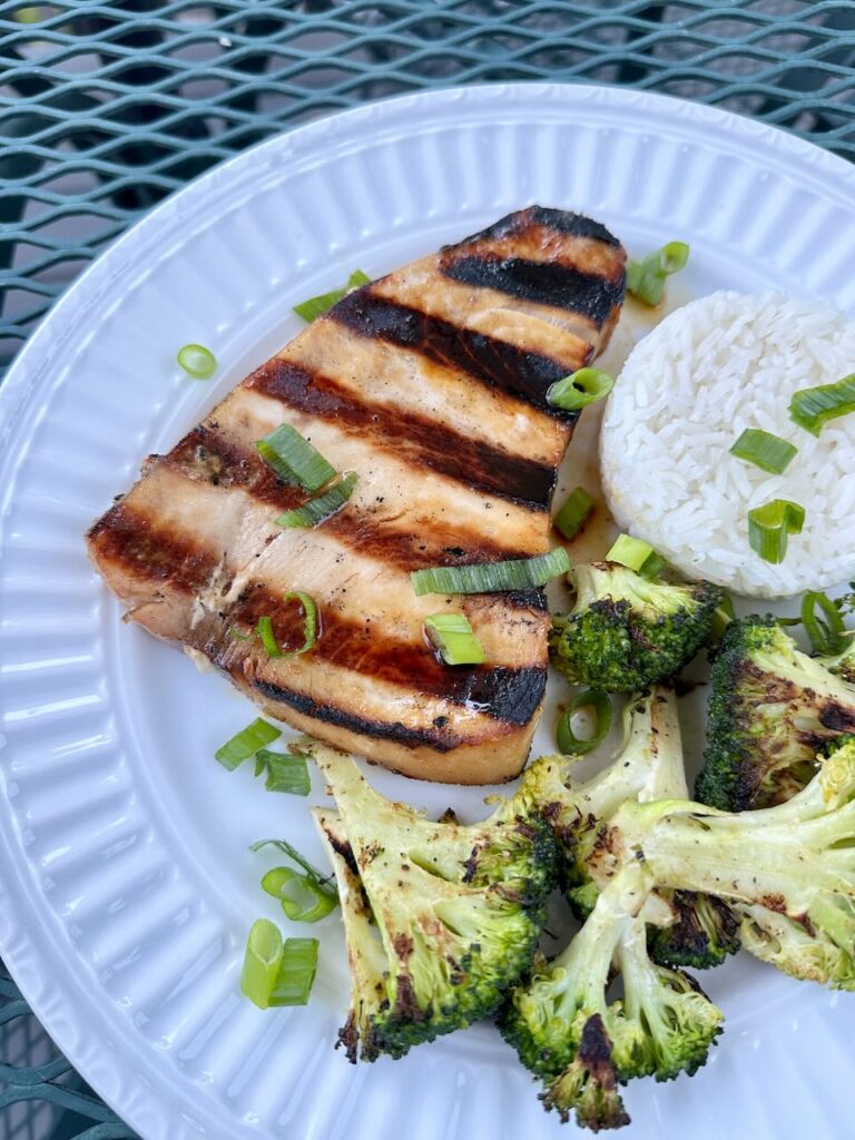 Miso Swordfish Steak after grilling on plate with rice and broccoli