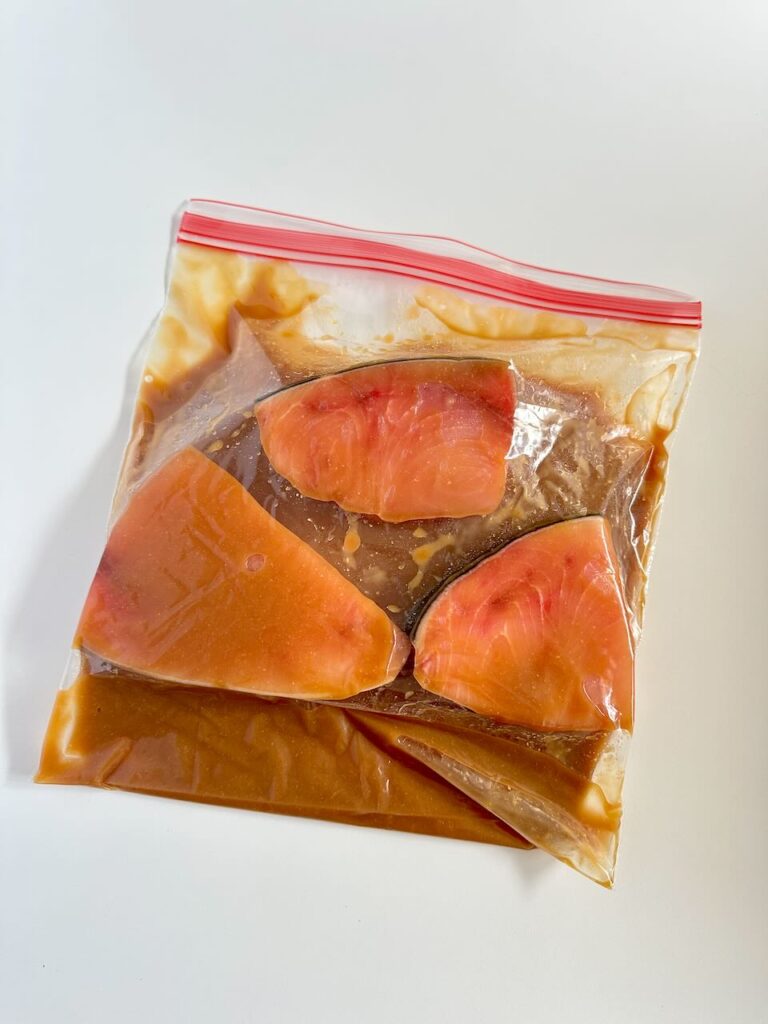Swordfish marinating in bag