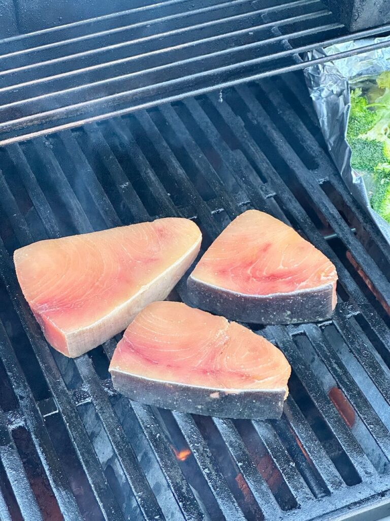 3 swordfish filets on grill before cooked