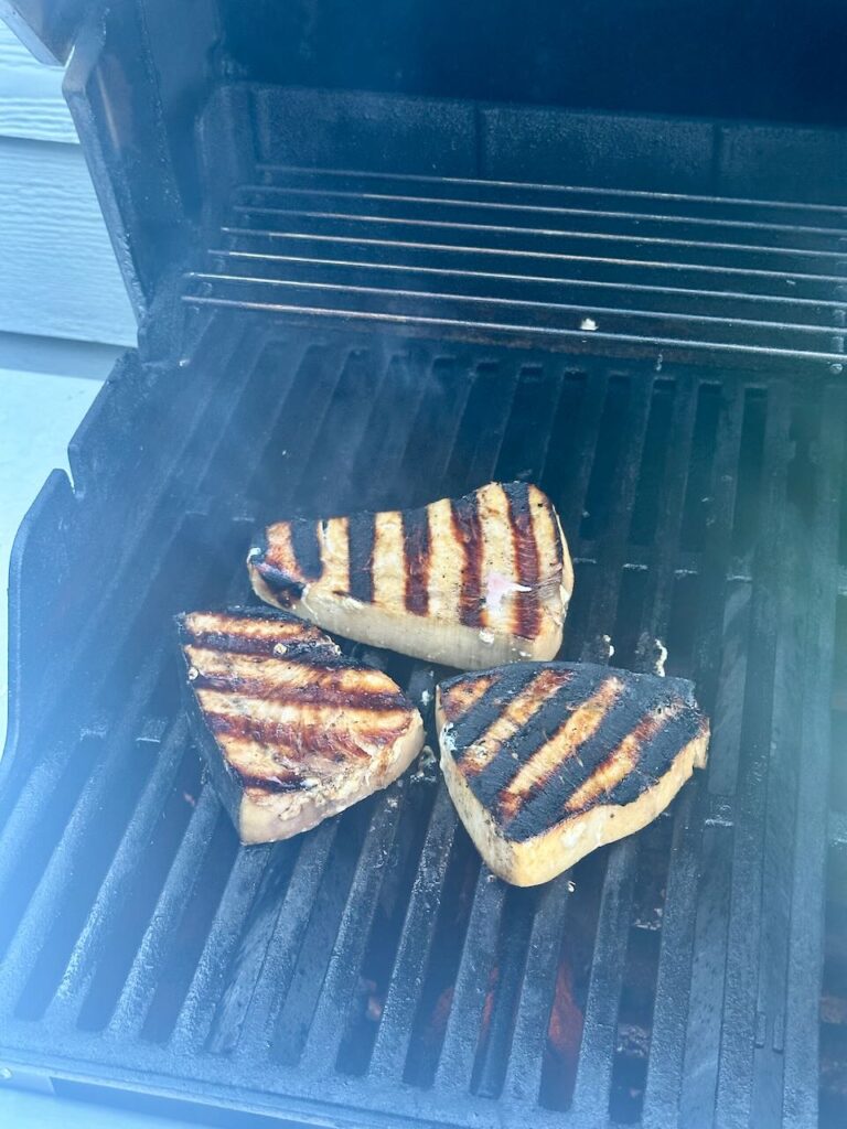 3 swordfish filets on grill after cooked