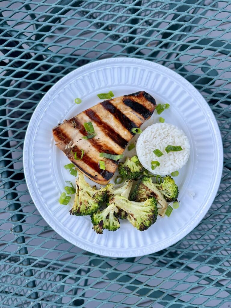 Miso Swordfish Steak on white plate with rice and broccoli