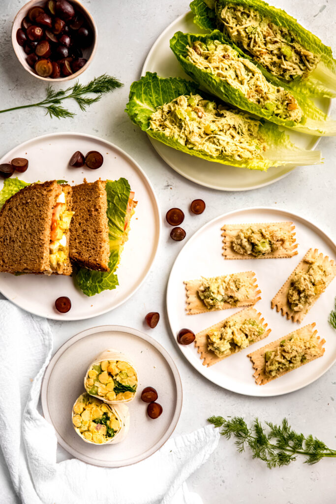 Chicken salad on lettuce leaves, on bread, on crackers, and in wrap.