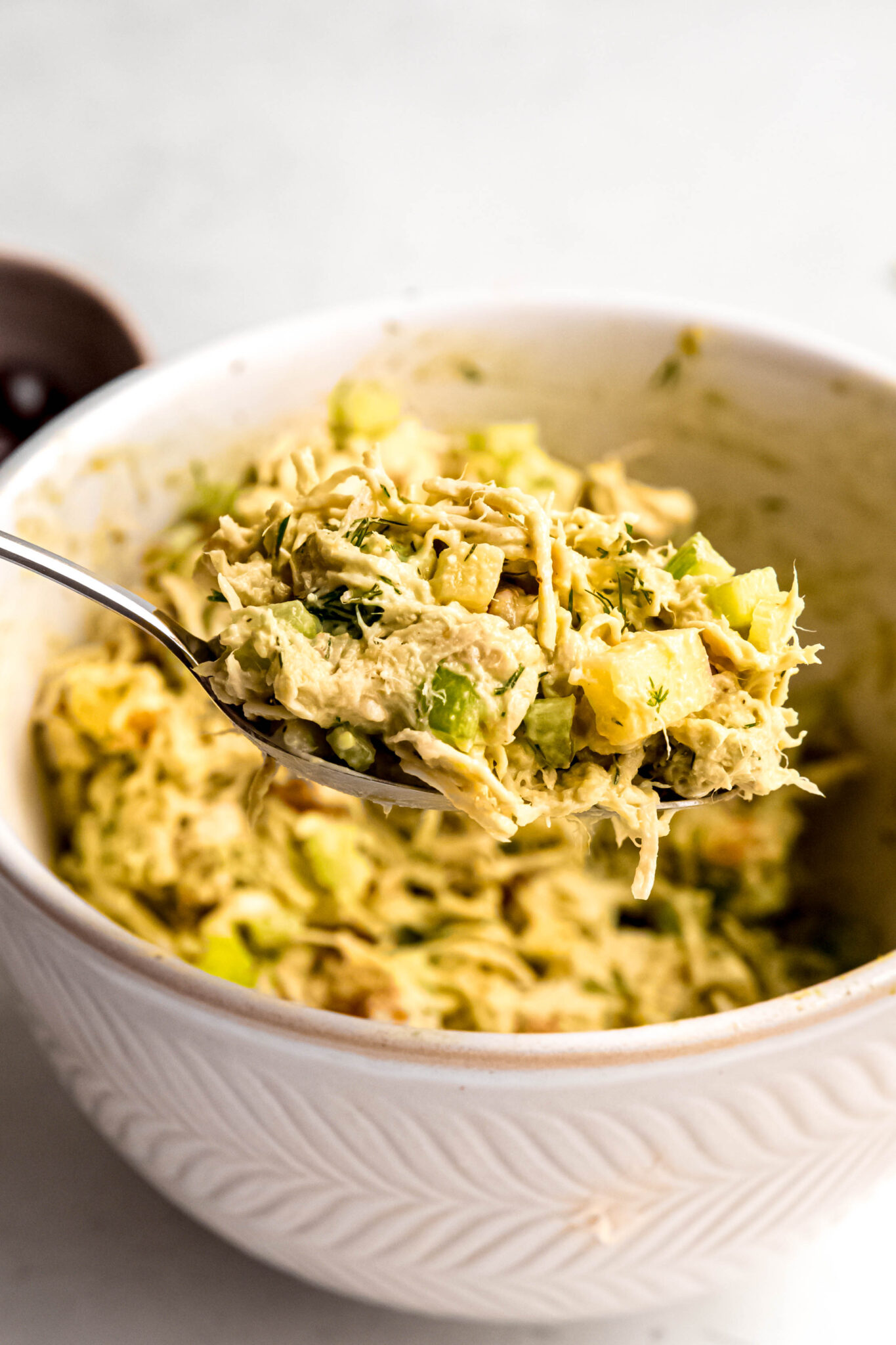 Salad base mixed together on fork