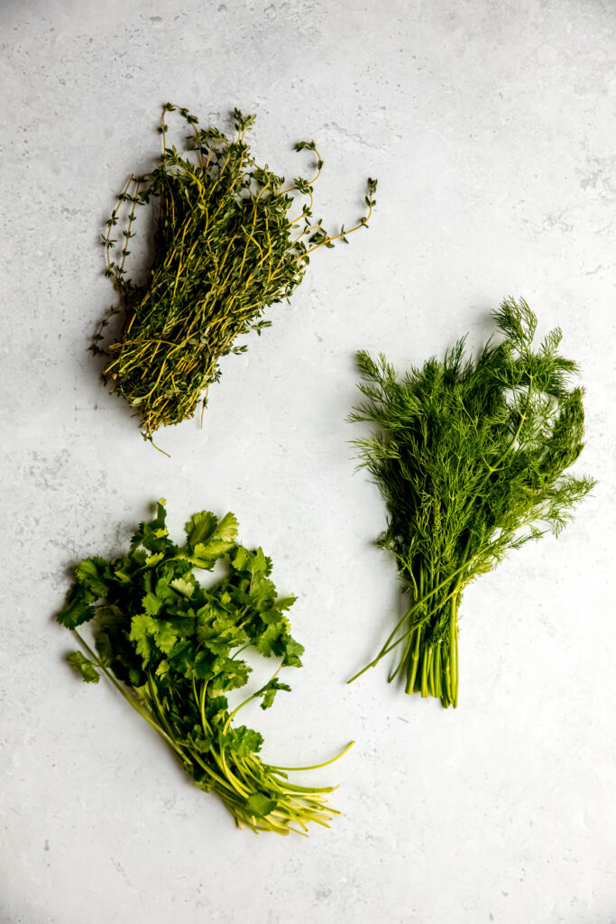 Herbs of choice laid out: thyme, dill, cilantro