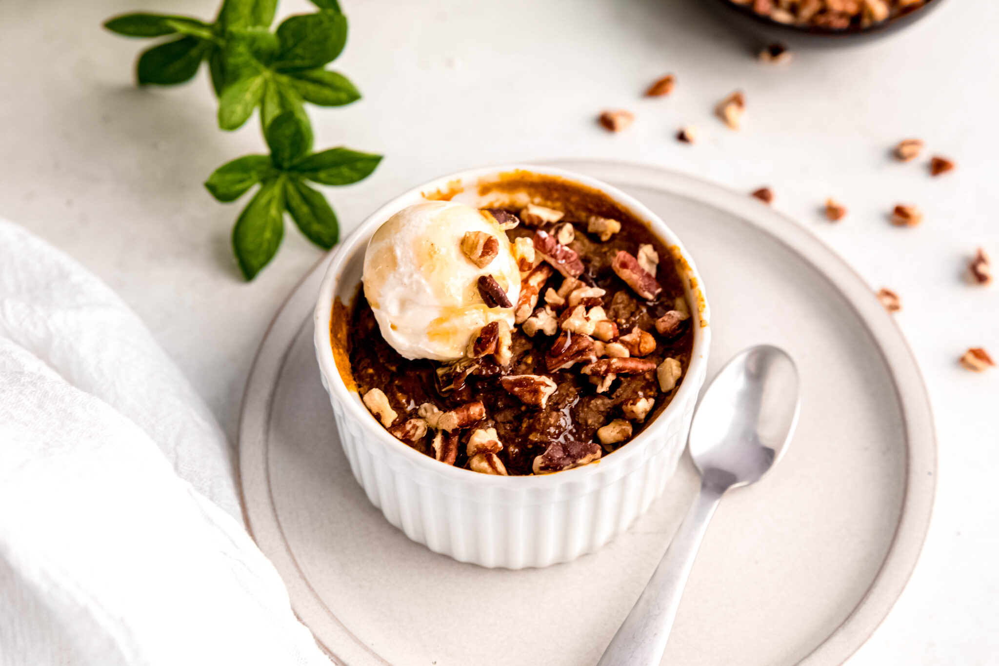 Customizable Baked Oats topped with pecans.