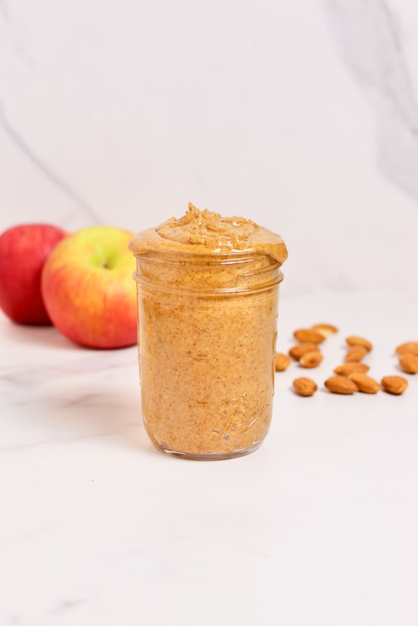 Customizable Nut Butter in jar with apples in background 