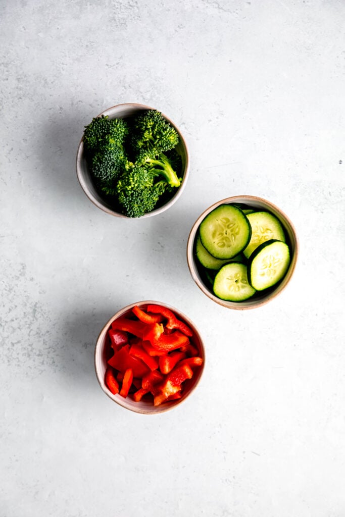 Veggies of your choice in white bowls
