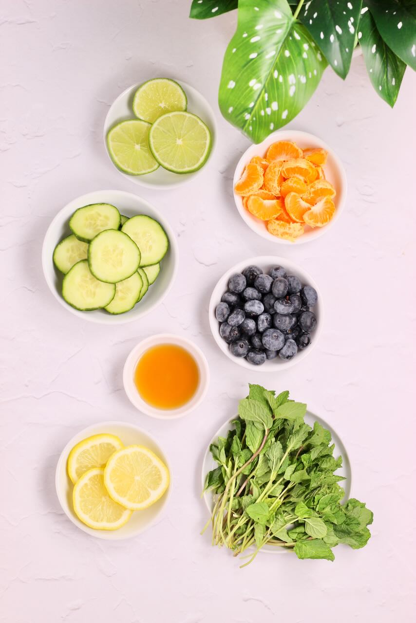 Ingredients for infused water in white bowls