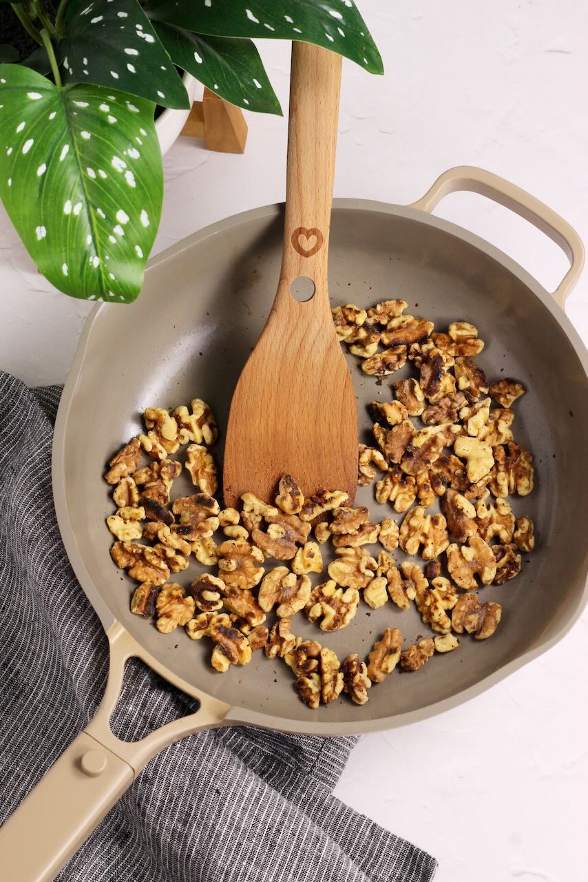 Toasted walnuts in skillet
