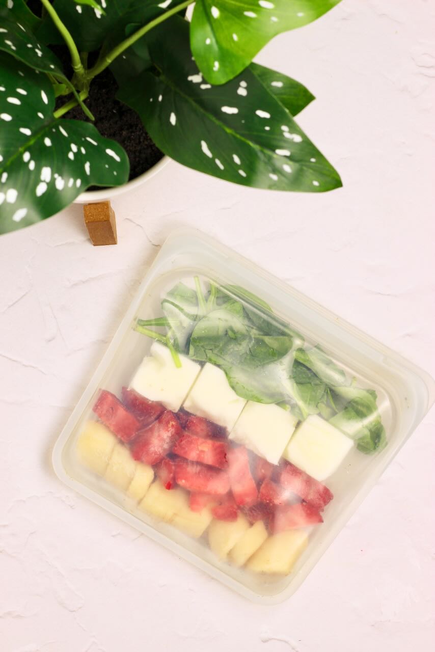 Frozen smoothie packs in freezer bag close up