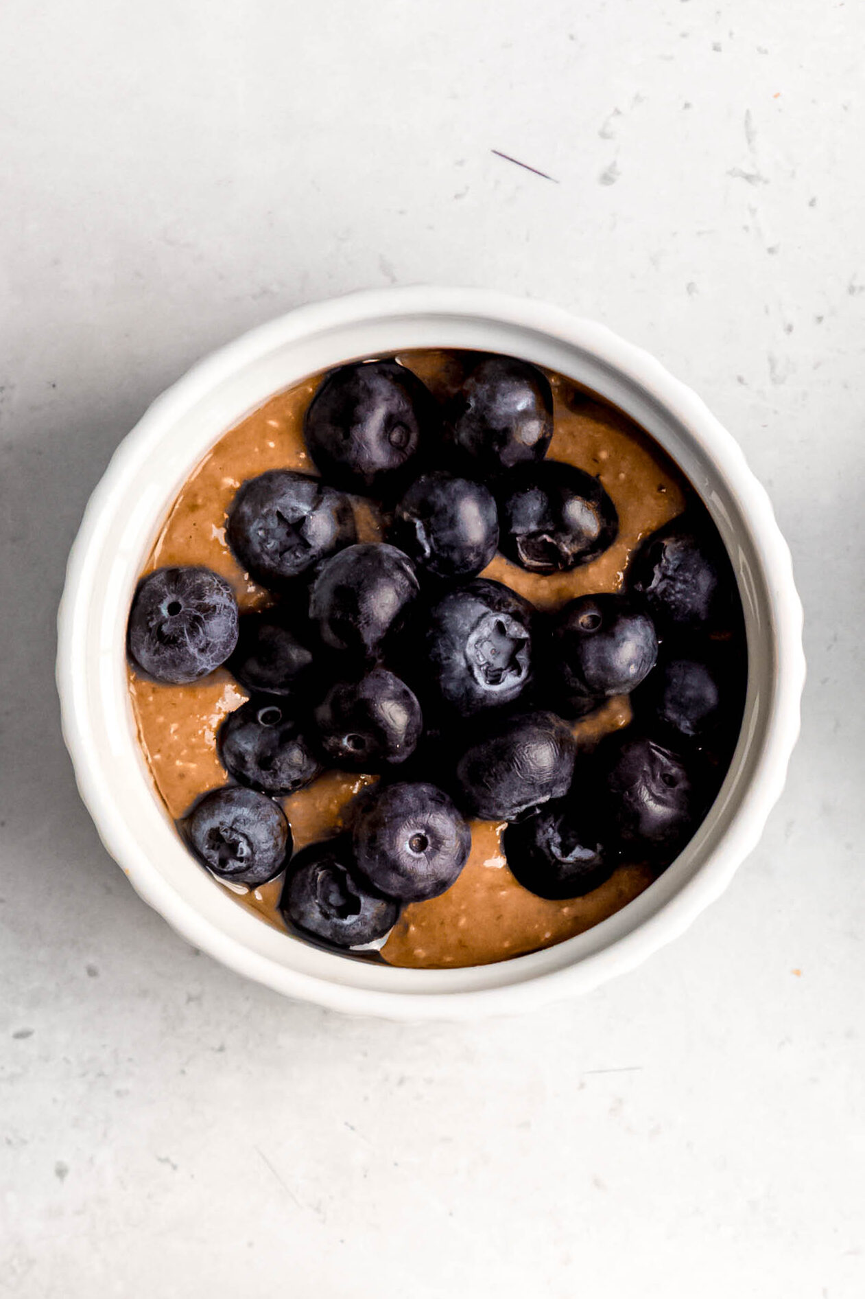batter with blueberries added before baking