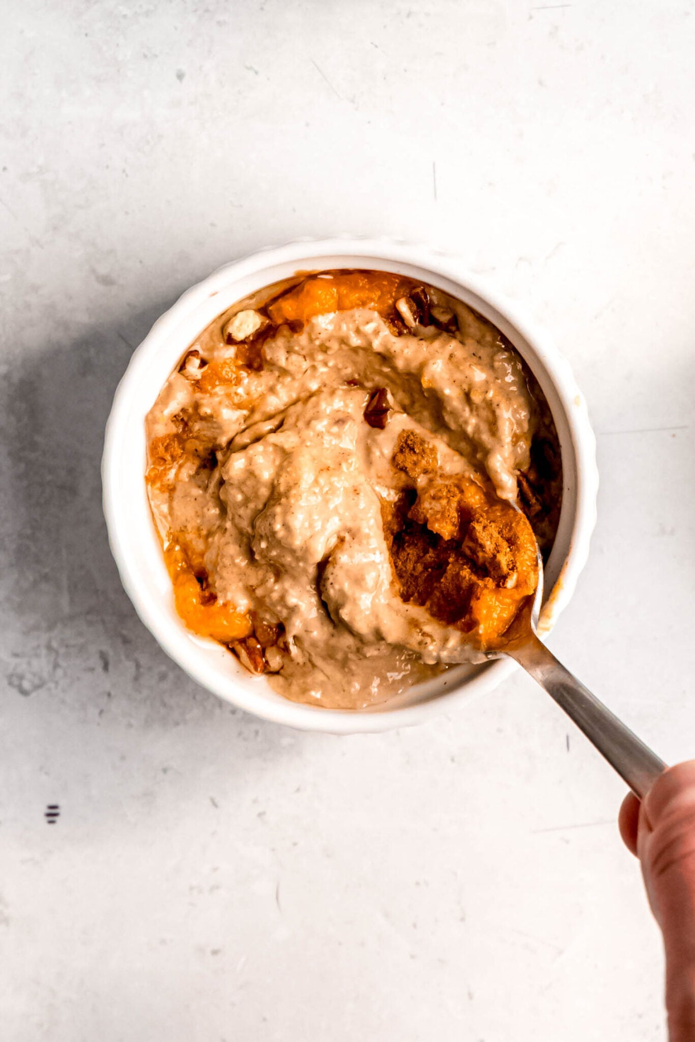 stirring in pumpkin puree and spices