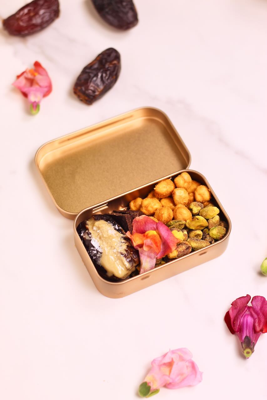 Snack tin with stuffed medjool date and chickpeas