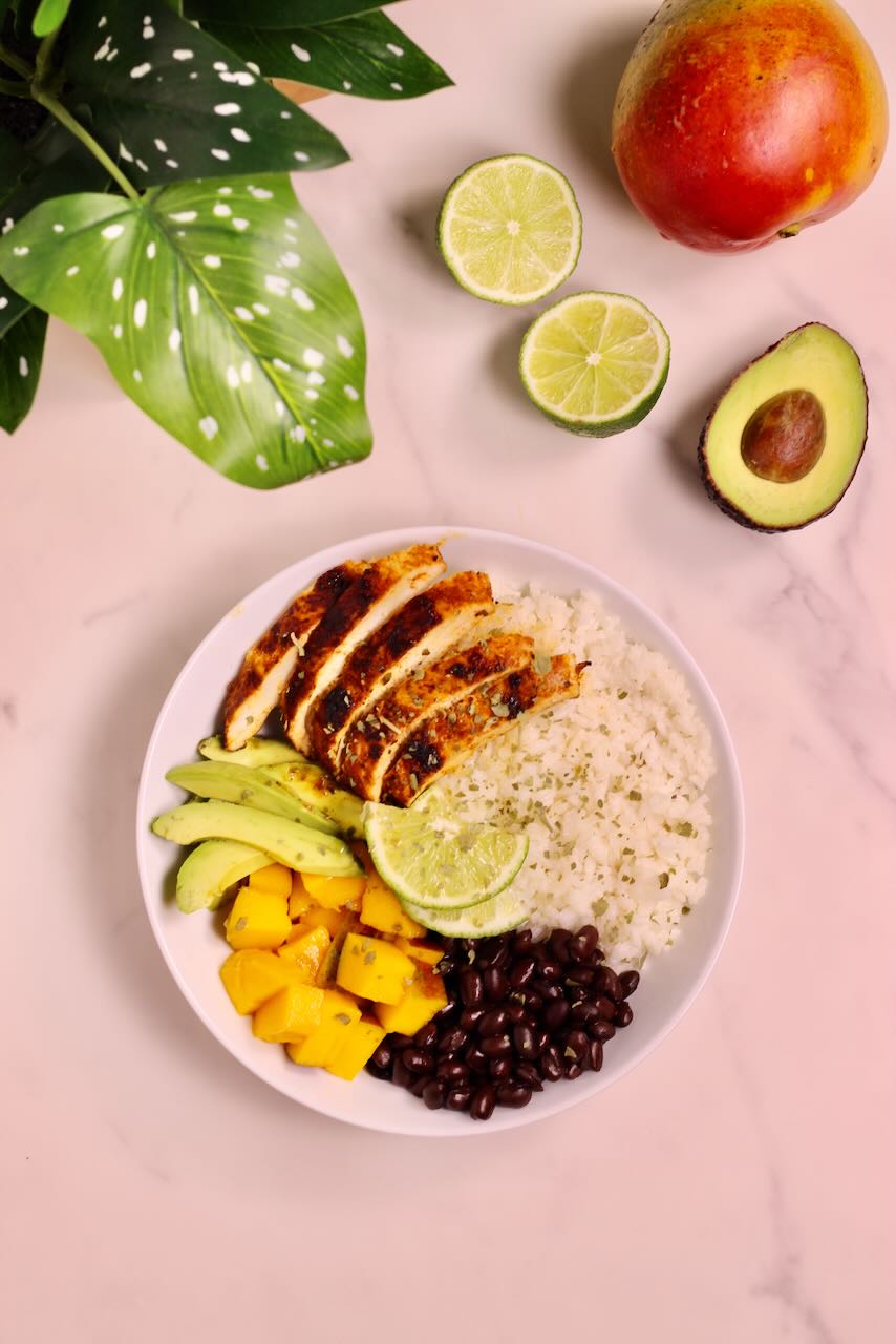 Mango Coconut Tropical Rice Bowl with avocado, lime, and mango on side