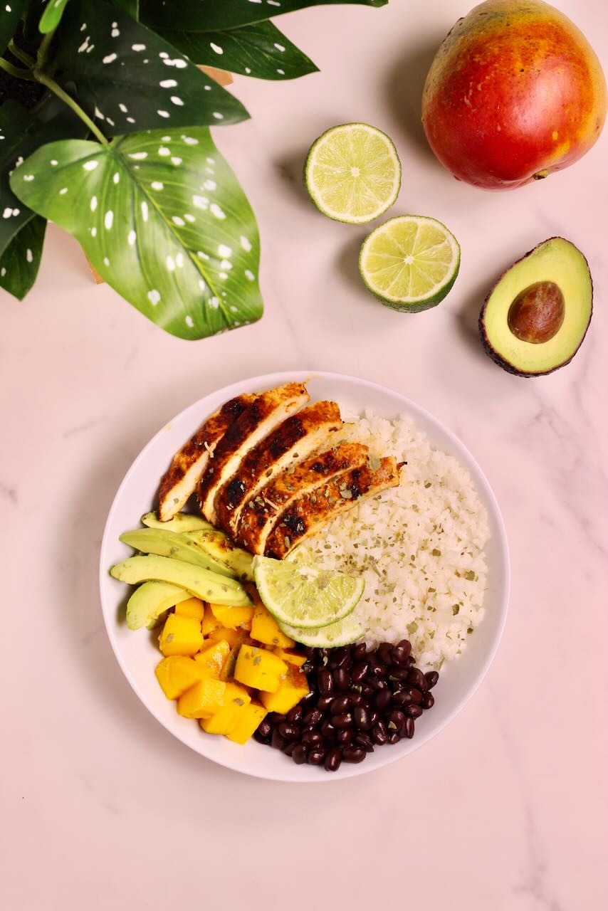 Mango Coconut Tropical Rice Bowl with avocado, lime, and mango on side
